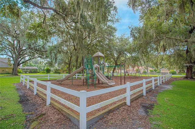 community jungle gym with a yard