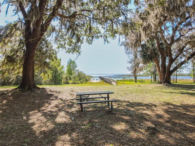 view of community with a water view