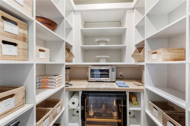 pantry featuring beverage cooler and a toaster