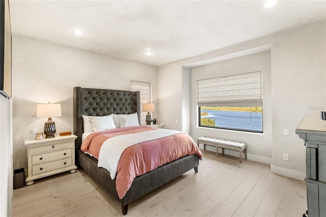 bedroom with recessed lighting, baseboards, and light wood-style flooring