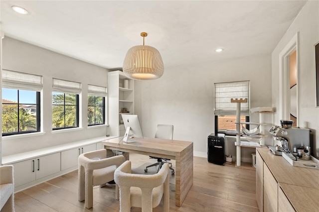 home office featuring recessed lighting, light wood-type flooring, and baseboards