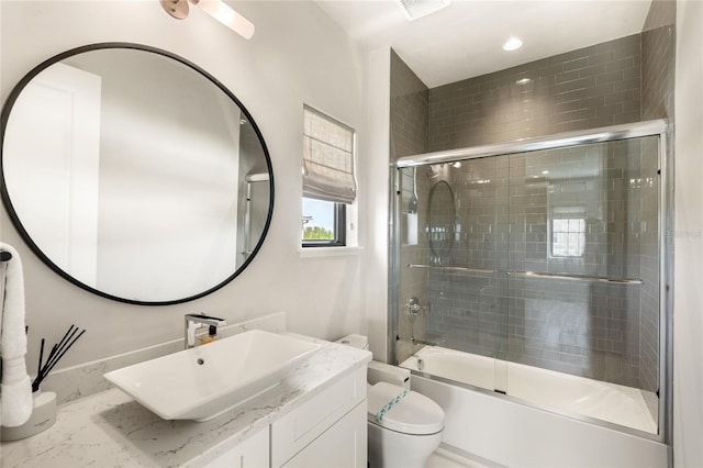 full bathroom featuring vanity, toilet, recessed lighting, and enclosed tub / shower combo