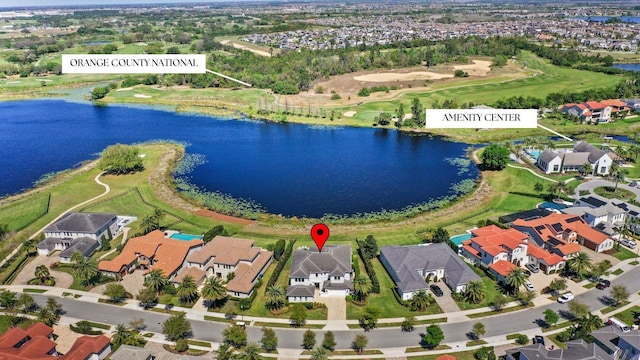 drone / aerial view featuring a residential view and a water view