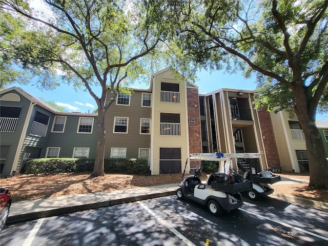 5064 Park Central Dr Unit 1731, Orlando, FL 32839 - view of property featuring uncovered parking