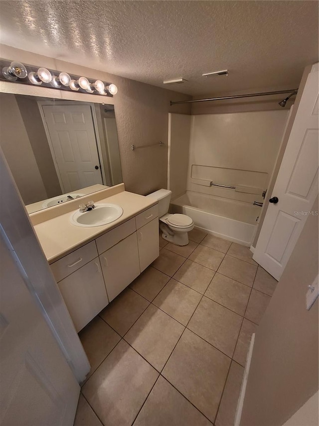 bathroom featuring visible vents, toilet, tile patterned flooring, tub / shower combination, and vanity