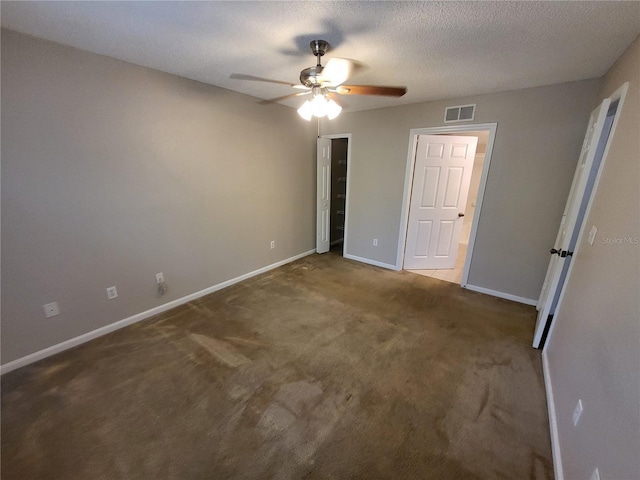 unfurnished bedroom featuring visible vents, baseboards, carpet floors, a textured ceiling, and a ceiling fan