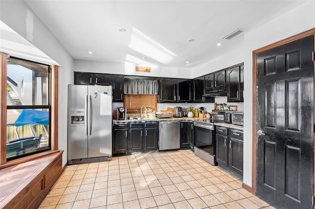 1475 Kettledrum Trl, Deltona, FL 32725 - kitchen featuring stainless steel appliances, a sink, dark cabinets, light tile patterned floors, and light stone counters