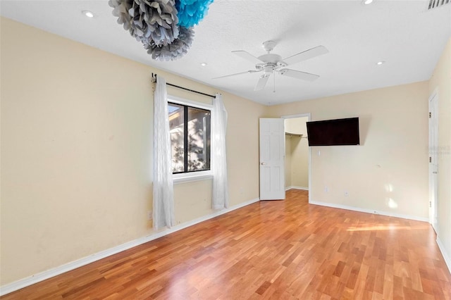 1475 Kettledrum Trl, Deltona, FL 32725 - unfurnished room featuring light wood-style flooring, baseboards, ceiling fan, and recessed lighting