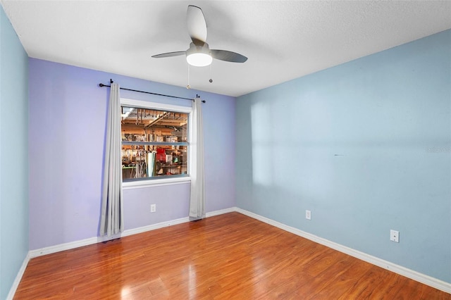1475 Kettledrum Trl, Deltona, FL 32725 - empty room with a ceiling fan, wood finished floors, and baseboards
