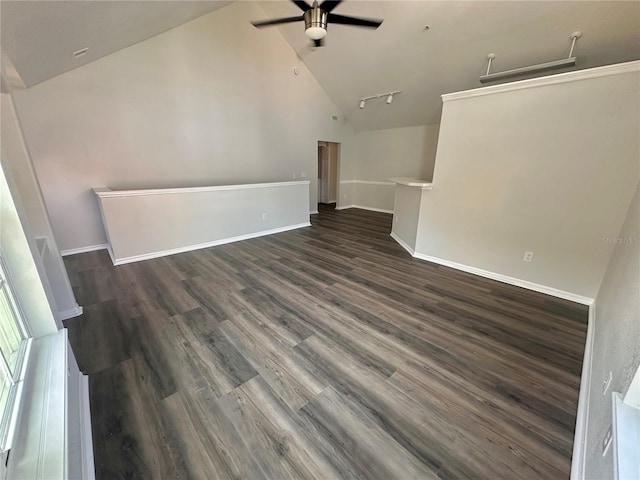 unfurnished living room with dark wood finished floors, high vaulted ceiling, baseboards, and ceiling fan