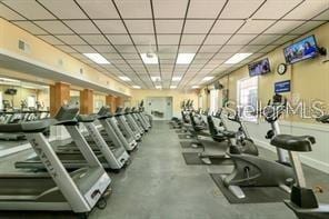 gym with a paneled ceiling