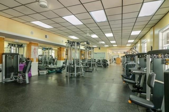 exercise room with a paneled ceiling