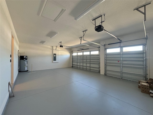 garage featuring electric panel, a garage door opener, and water heater