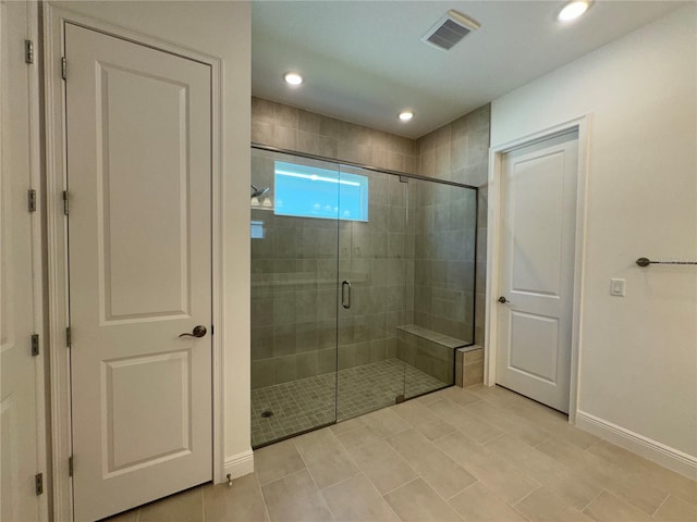 bathroom with recessed lighting, visible vents, baseboards, and a stall shower