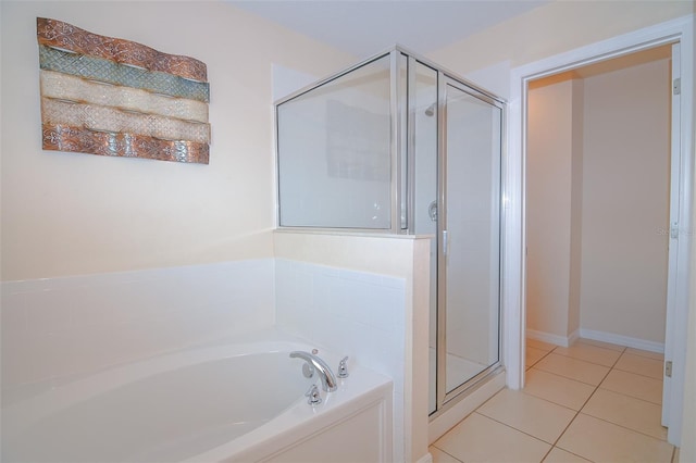 full bath featuring a bath, tile patterned floors, and a stall shower