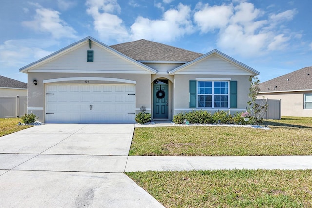 ranch-style house with driveway, an attached garage, a front lawn, and fence