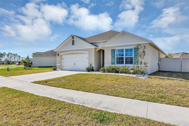 single story home with fence, driveway, stucco siding, a front lawn, and a garage