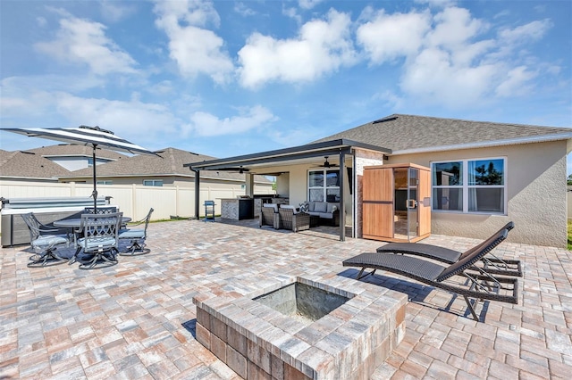 view of patio / terrace featuring an outdoor living space, outdoor dining area, fence, and ceiling fan