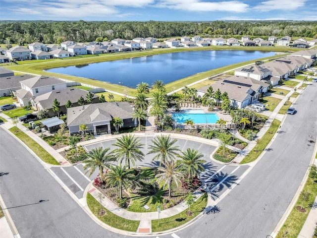 aerial view with a residential view and a water view