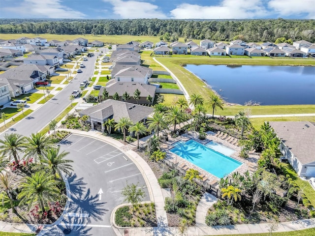 bird's eye view featuring a residential view and a water view