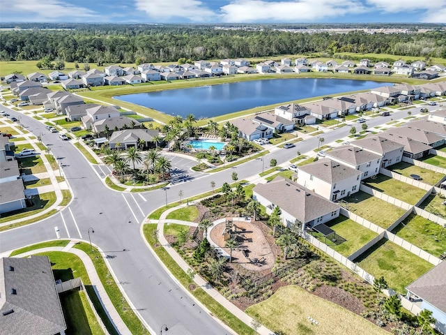 aerial view featuring a residential view and a water view