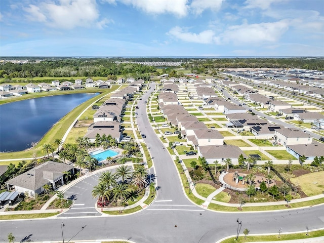 aerial view with a residential view and a water view