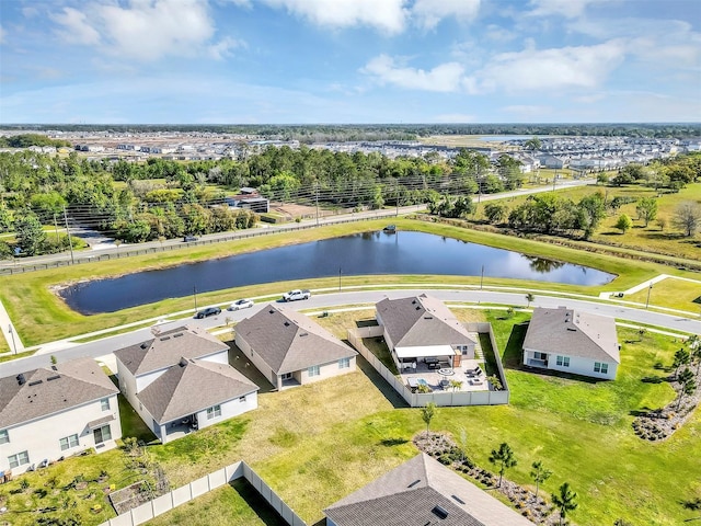 drone / aerial view with a water view and a residential view