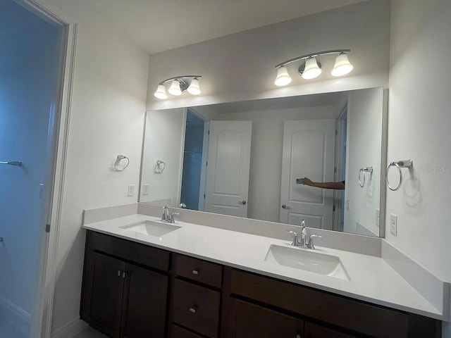 bathroom with double vanity and a sink