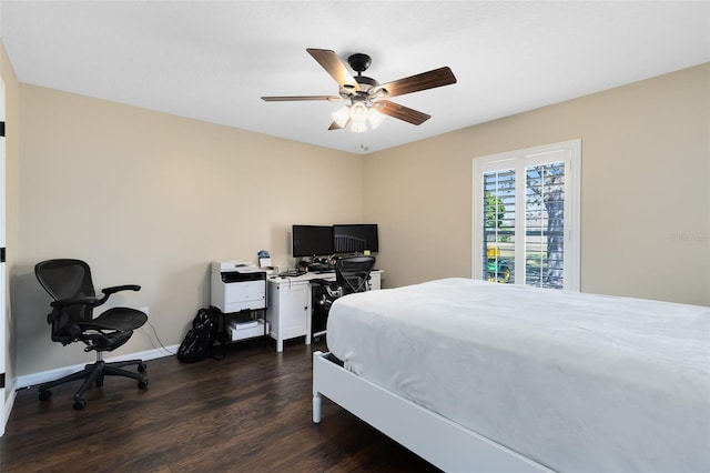 bedroom featuring a ceiling fan, dark wood-type flooring, and baseboards