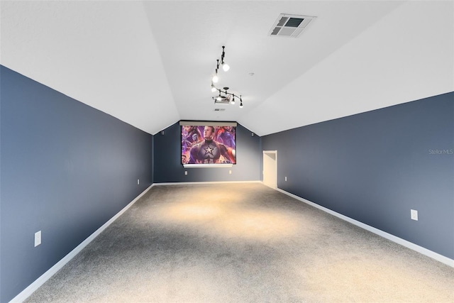 bonus room featuring lofted ceiling, baseboards, visible vents, and carpet floors