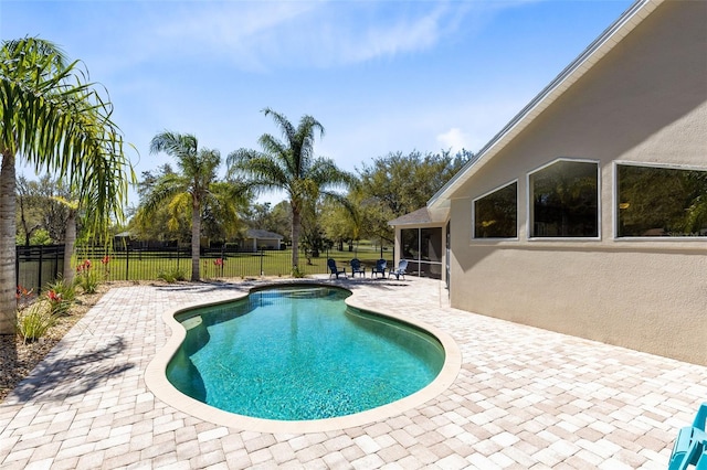 view of swimming pool featuring a patio, a fenced backyard, and a fenced in pool