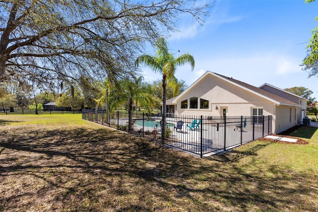 view of pool featuring a fenced in pool, a patio, a yard, and fence