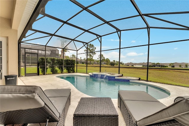 pool with glass enclosure, a hot tub, a lawn, and a patio