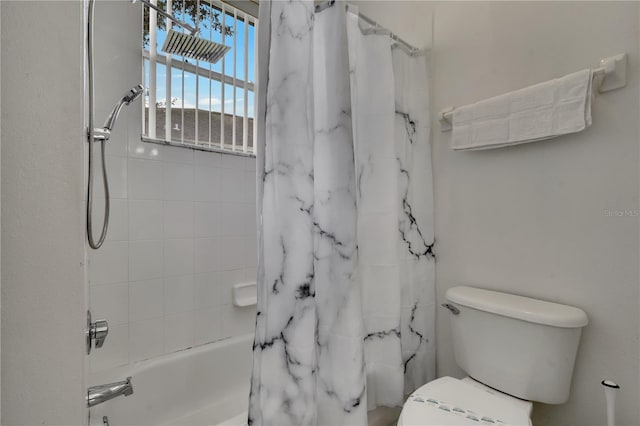 full bathroom featuring toilet and shower / tub combo with curtain