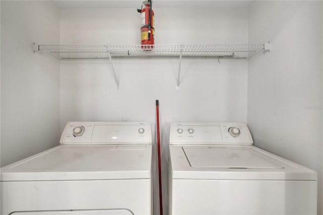 laundry area with laundry area and separate washer and dryer