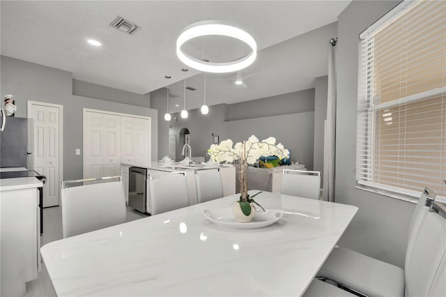 dining area featuring visible vents