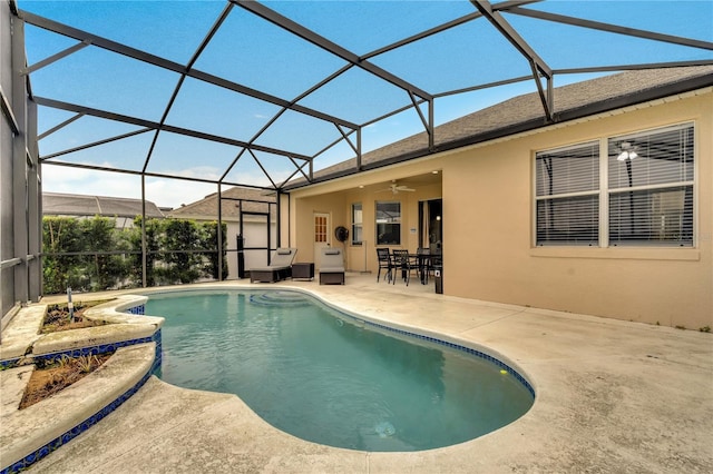 pool with a patio, a lanai, and a ceiling fan