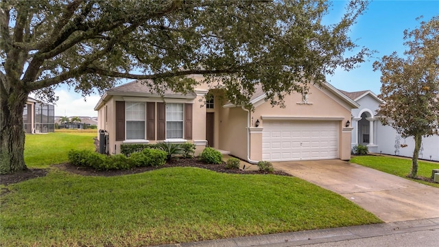 view of front of home featuring a front yard, an attached garage, concrete driveway, and stucco siding