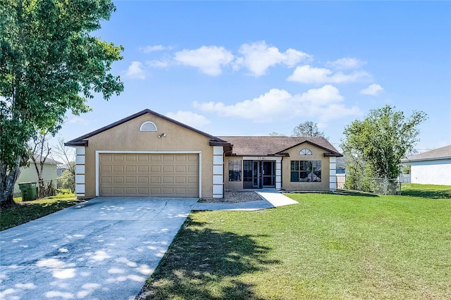 ranch-style home featuring stucco siding, fence, concrete driveway, an attached garage, and a front yard