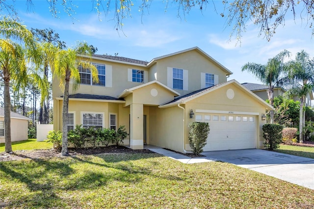 traditional-style home featuring stucco siding, a front lawn, concrete driveway, and a garage