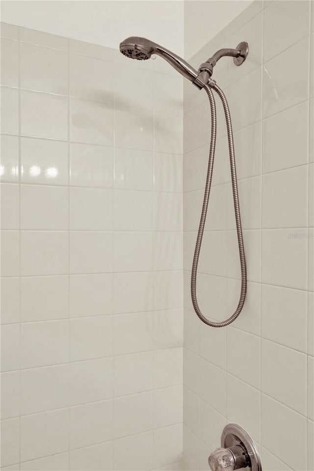 details with a tile shower