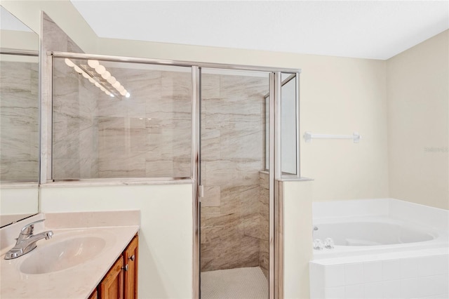 bathroom featuring vanity, a shower stall, and a garden tub