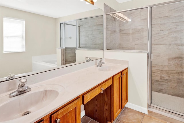 full bath featuring double vanity, a stall shower, and a sink