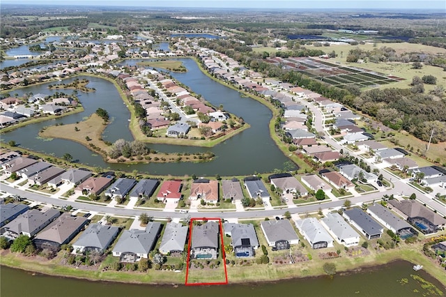 birds eye view of property featuring a residential view and a water view