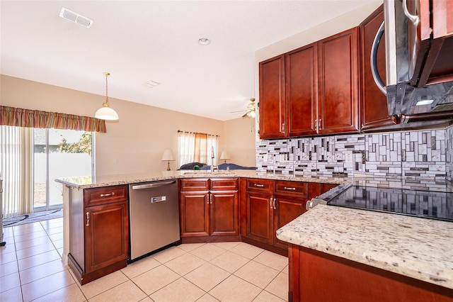 kitchen featuring visible vents, a peninsula, appliances with stainless steel finishes, reddish brown cabinets, and backsplash