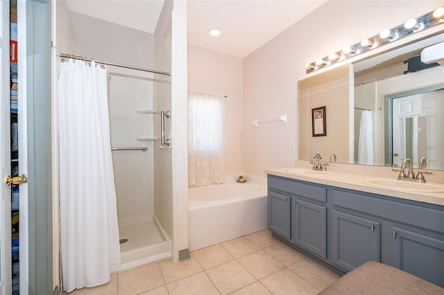 full bath with tile patterned flooring, a garden tub, a shower with curtain, and a sink