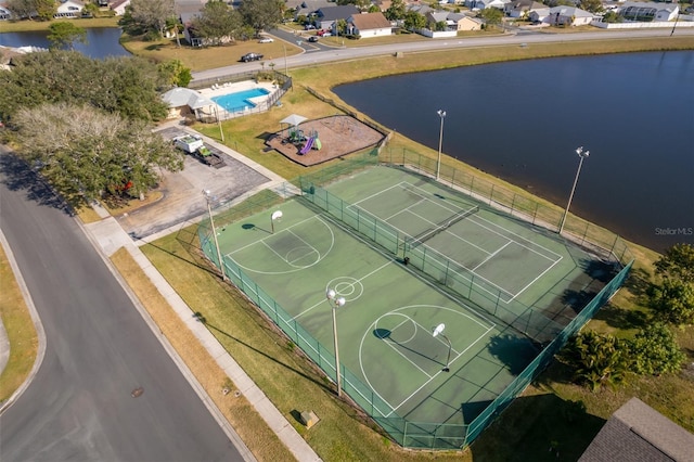 birds eye view of property featuring a water view