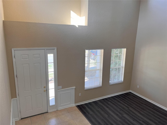 entrance foyer featuring tile patterned flooring and baseboards