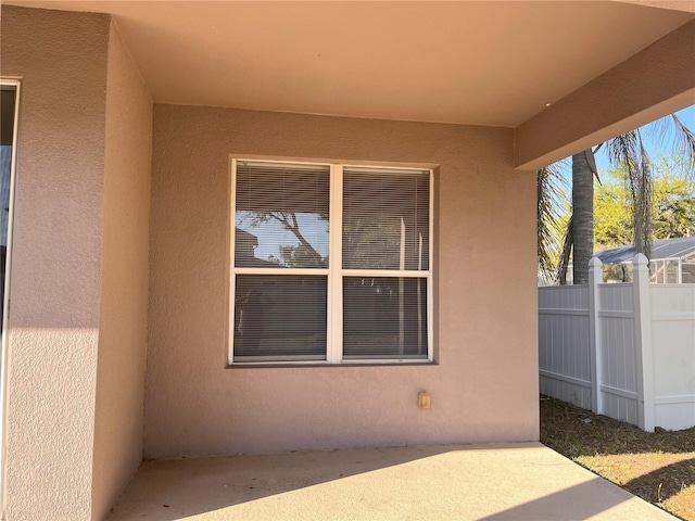 view of patio featuring fence