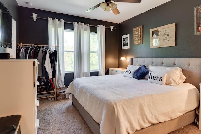 bedroom featuring carpet and a ceiling fan